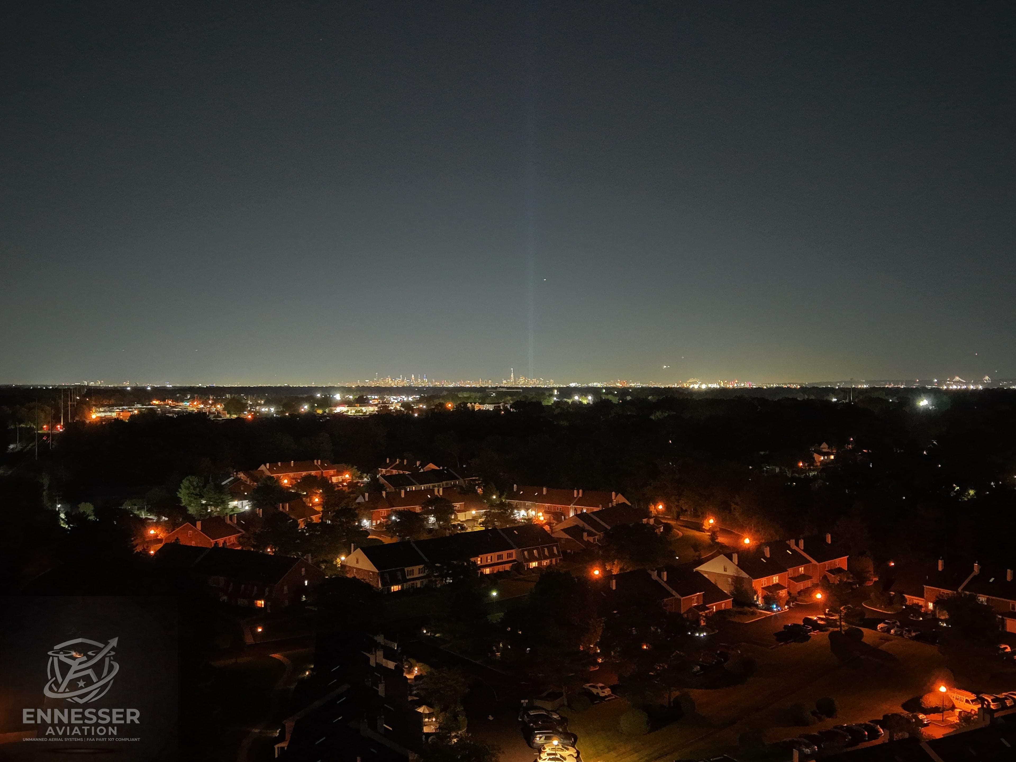 Aerial photograph of the 9/11 Tribute in Light memorial beams rising over Lower Manhattan, captured from New Jersey on the 25th Anniversary of September 11, 2026